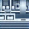 Icon depicting a sterile factory environment with machinery, symbolizing manufacturing.